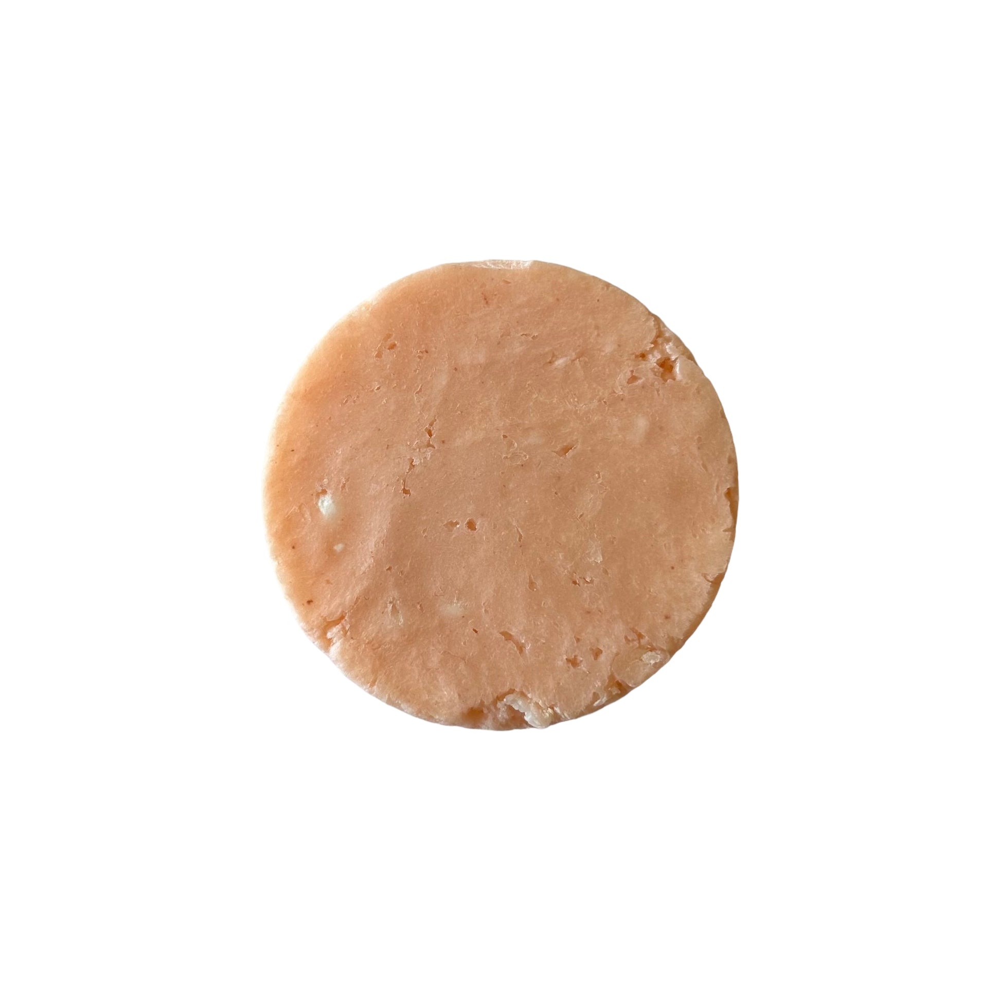 blood orange and grapefruit scented shampoo bar, orange color round shape