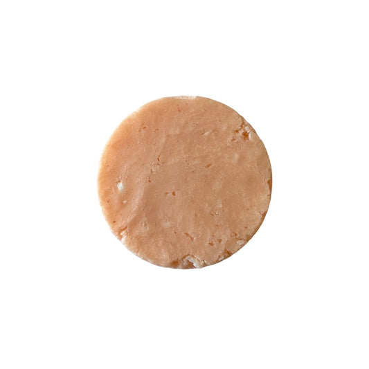 blood orange and grapefruit scented shampoo bar, orange color round shape