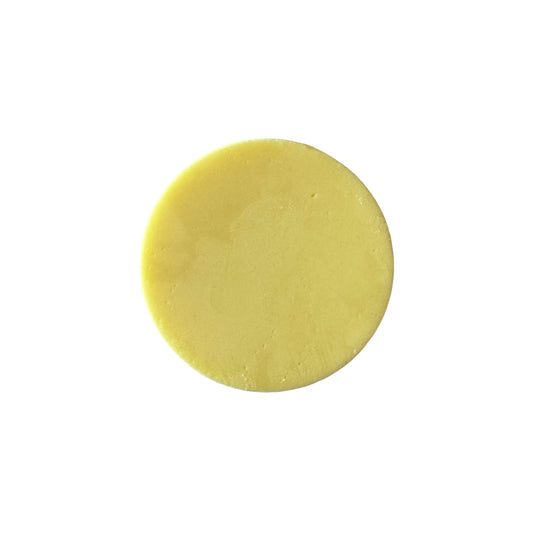 neroli blossom conditioner bar, yellow color round shape