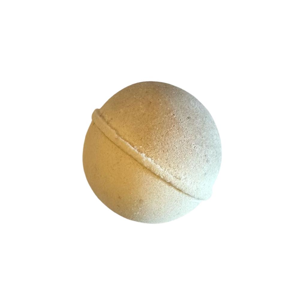 beige colored bath bomb with honey vintage signature scent