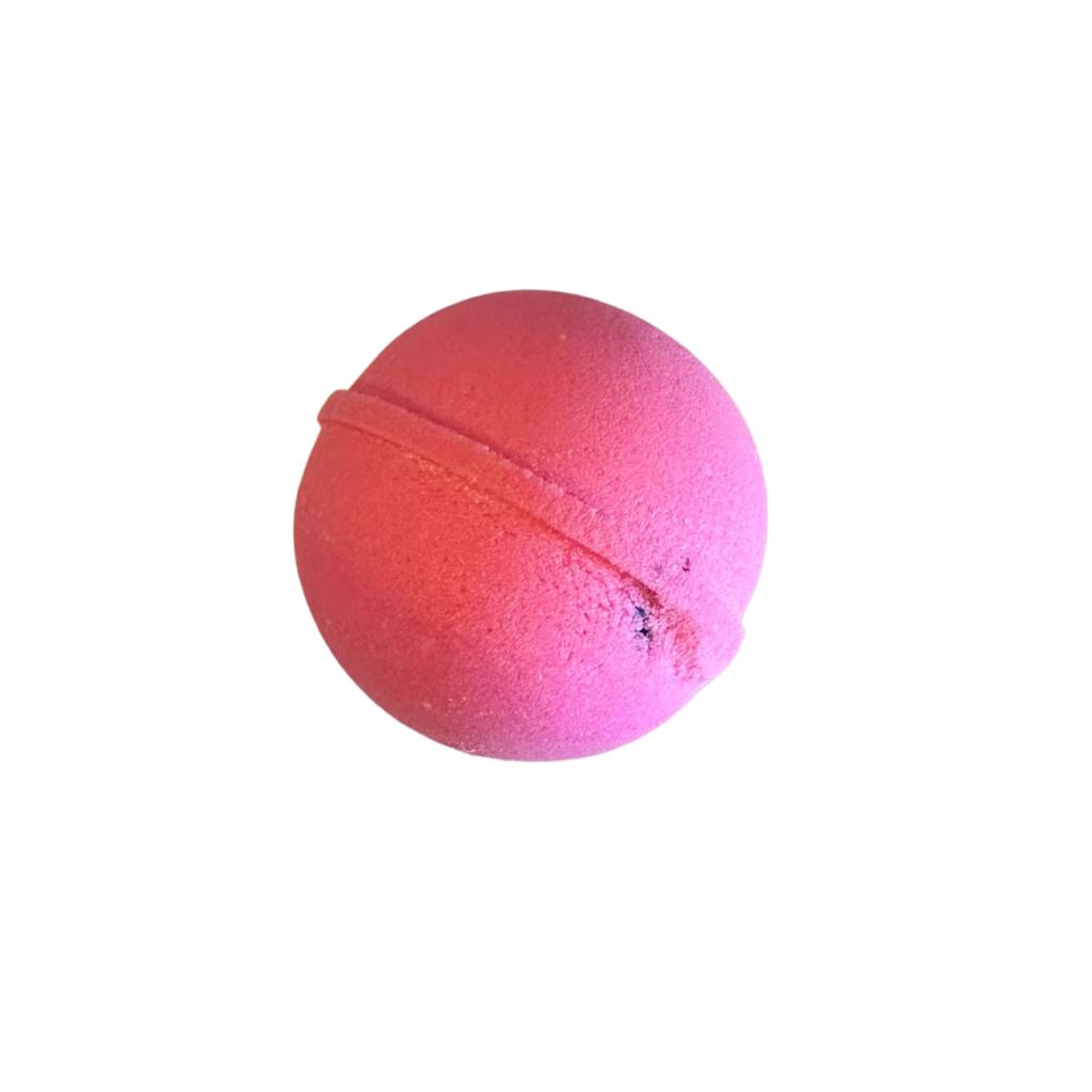 pink colored bath bomb with pomegranate soda scent